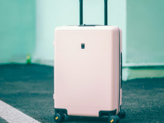 white and black luggage